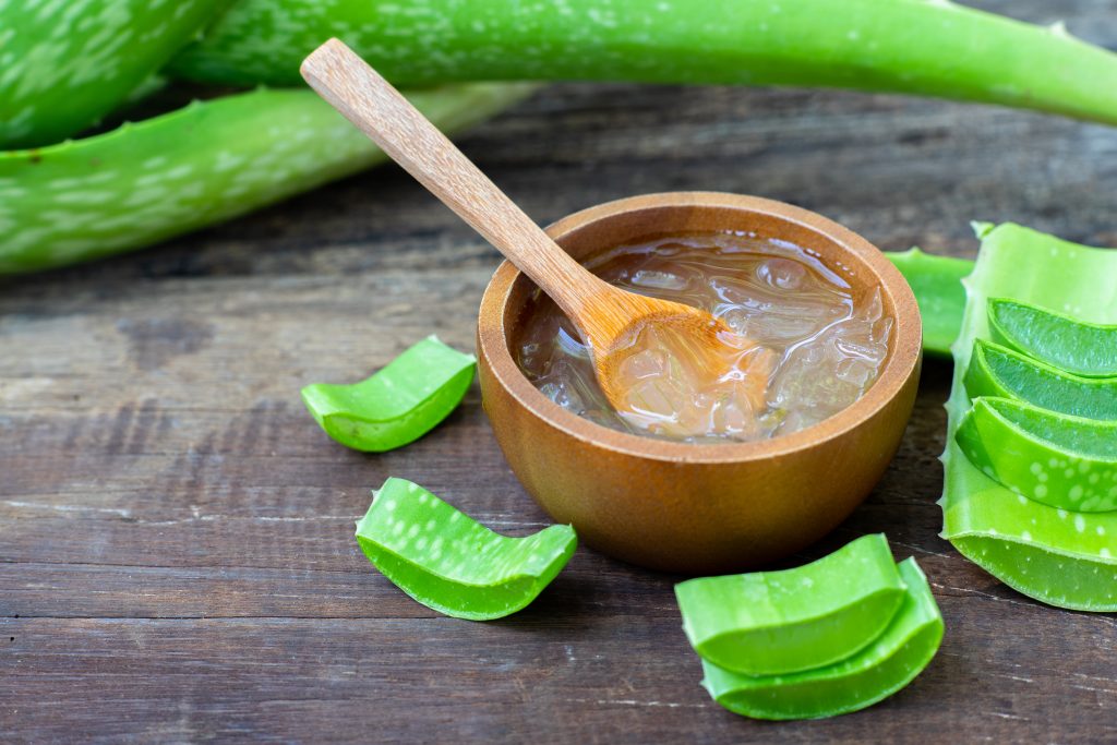 Aloe vera gel in a wooden bowl.